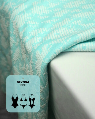 135 सेमी चौड़ाई, 195 जीएसएम वजन और 50% पुनर्नवीनीकरण पॉलिएस्टर संरचना के साथ प्रीमियम टेक्सचर्ड स्विम फैब्रिक